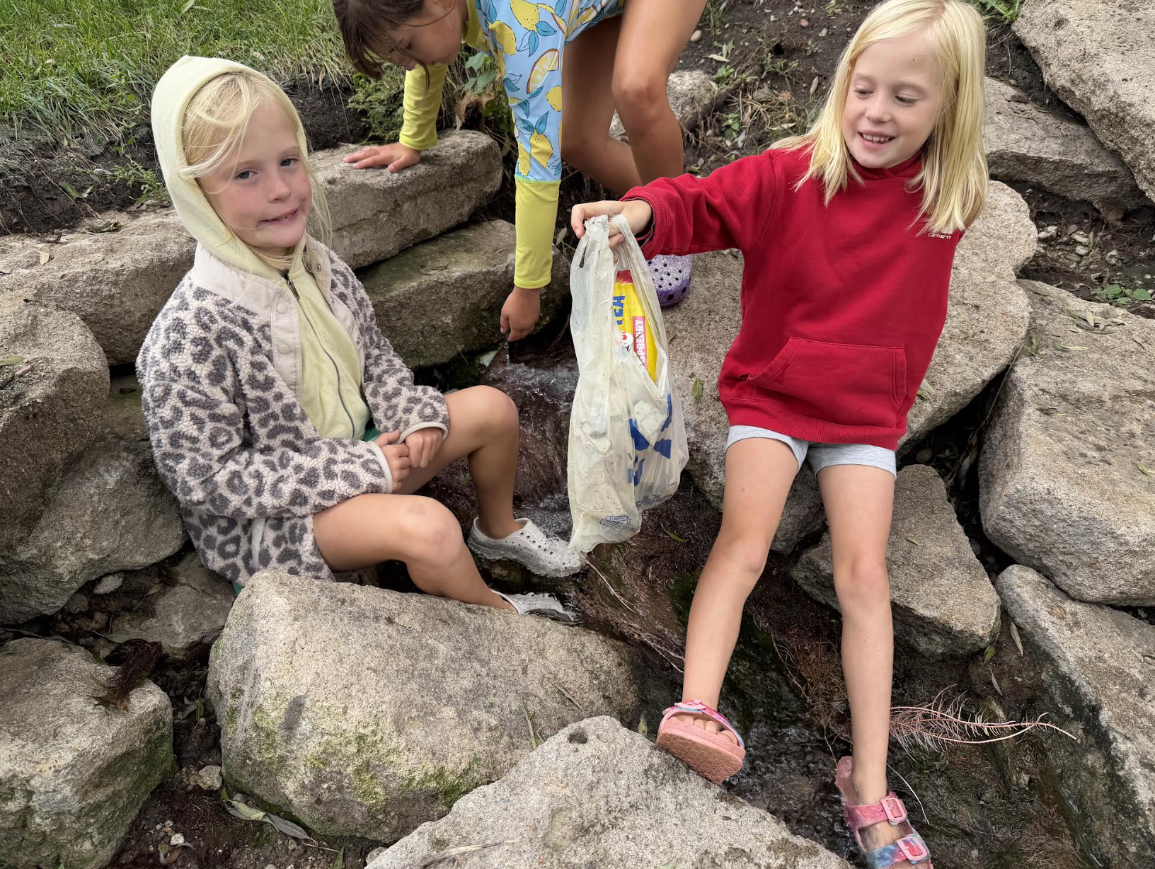 2nd grade girls cleaning up the park.